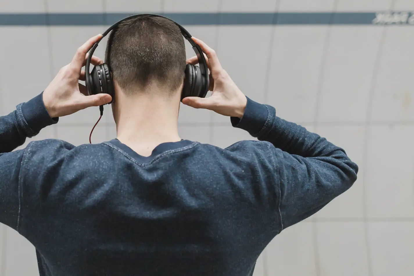 Turn Down the Volume: Talking Quieter with Headphones On