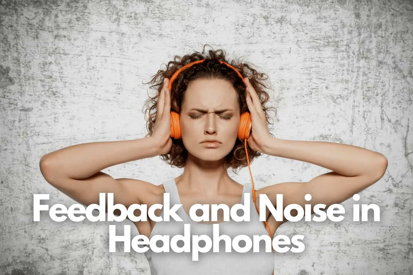 Lady holding headphones over her ears to cut out outside noise