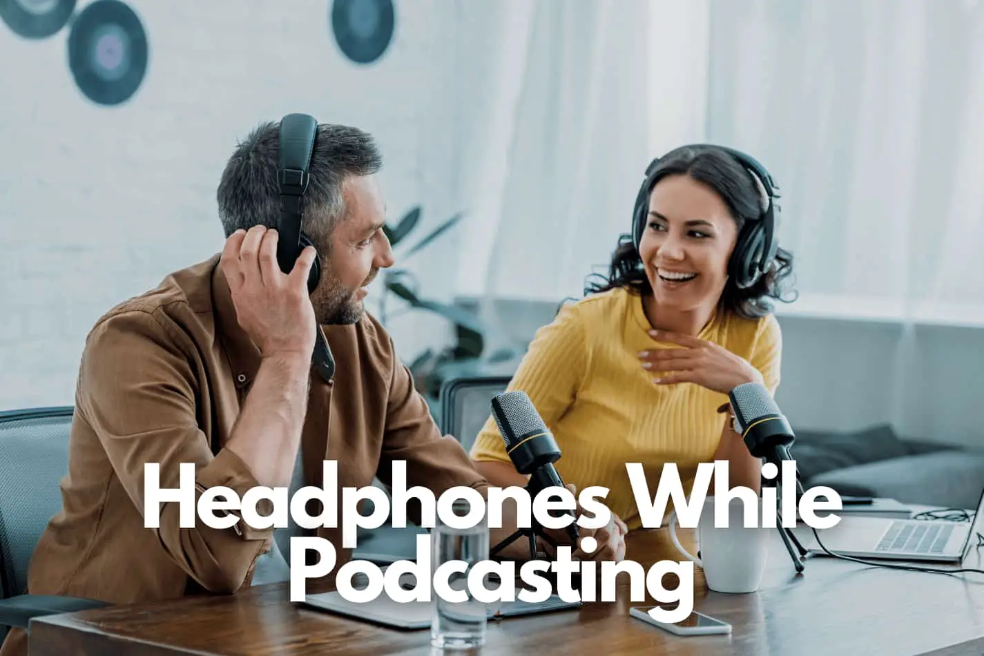 tow podcasters talking on headphones - why wear headphones while podcasting